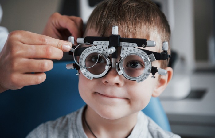 Pediatric patient receiving eye exam