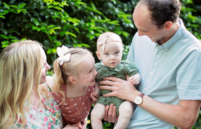 Family photo of Kacy and Daniel Tucker with their two daughters