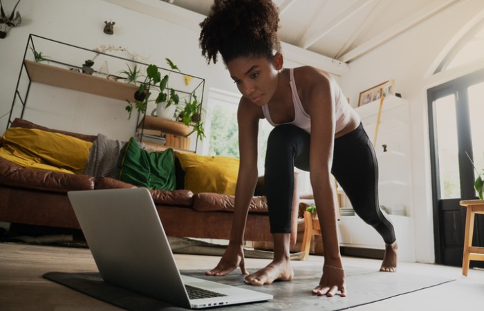 Woman exercising on her computer