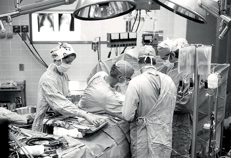 Black and white photo of a transplant surgery underway