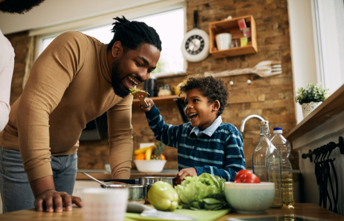 Father and son sharing a healthy snack