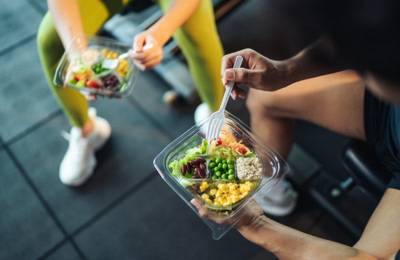 photo of couple eating salad