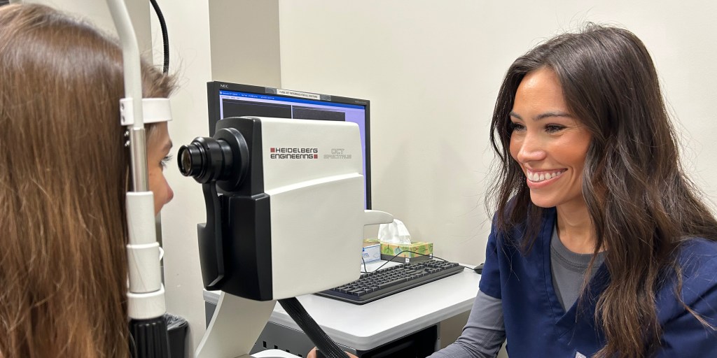 Female eye doctor conducting an eye exam