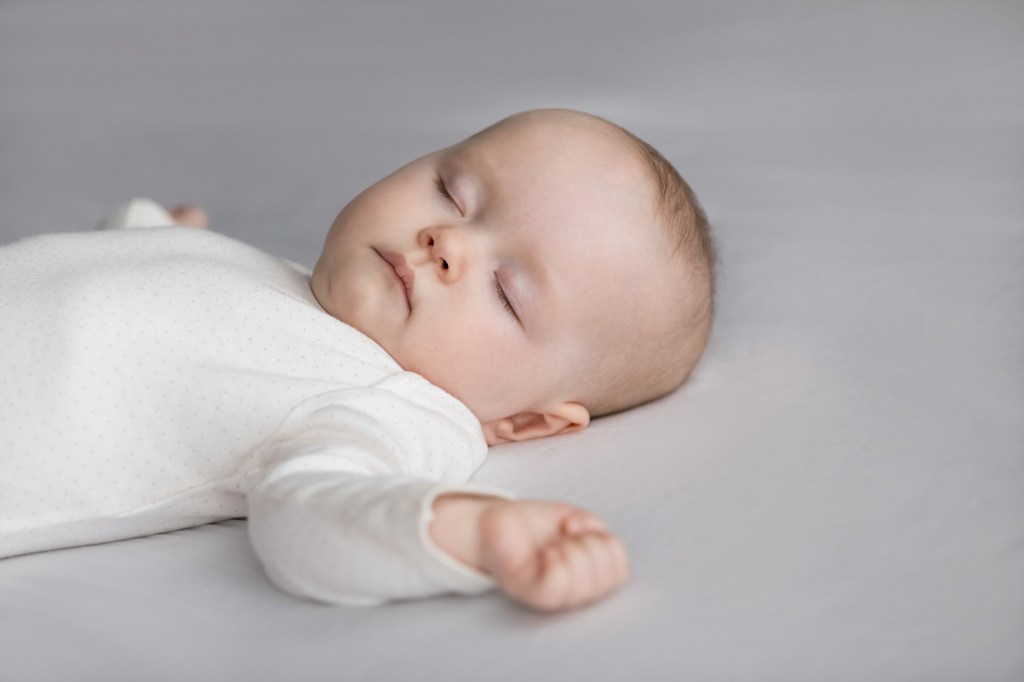 infant exhibiting Safer infant sleep posture